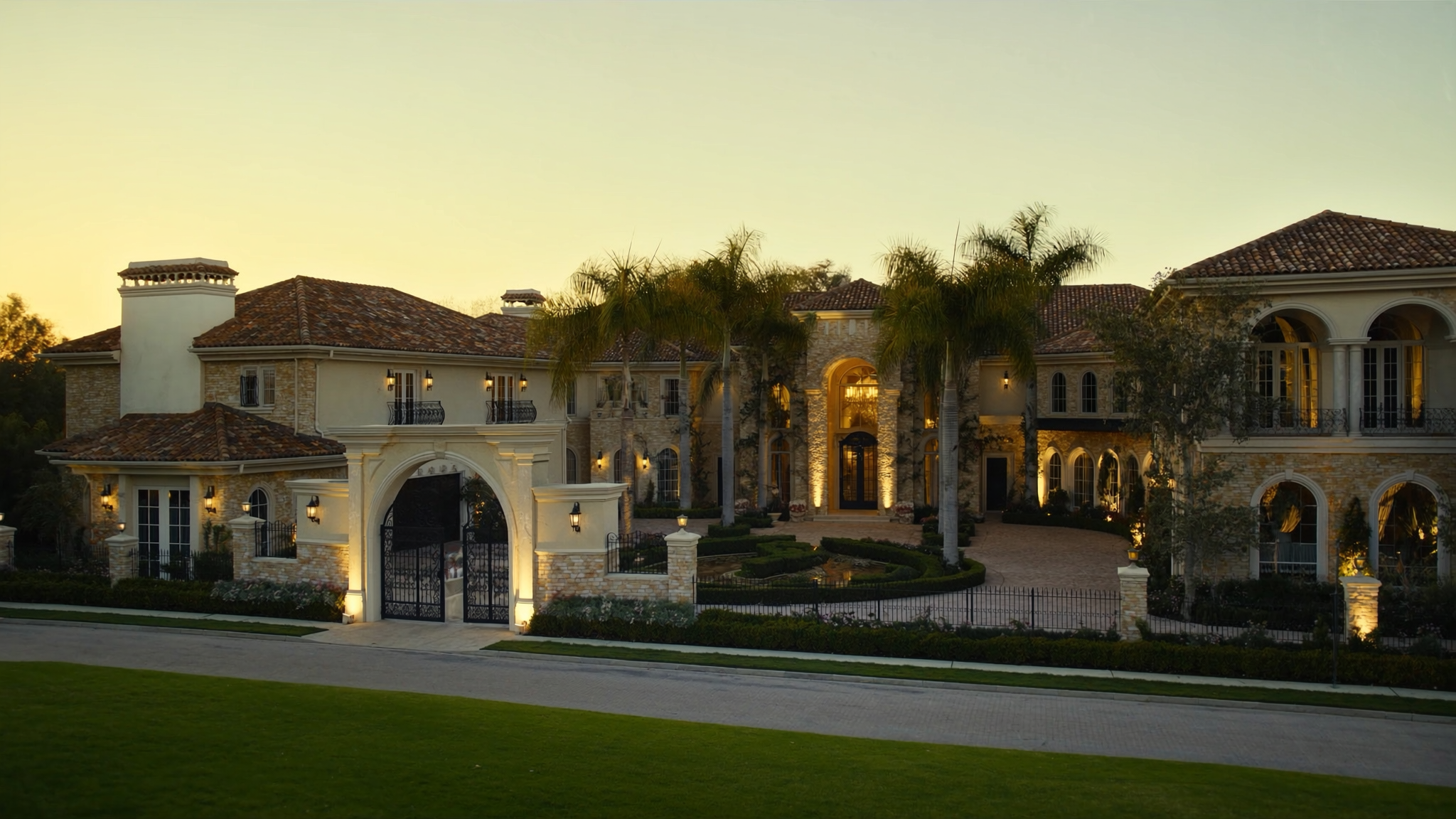 Mediterranean luxury estate with terracotta tile roof at golden hour
